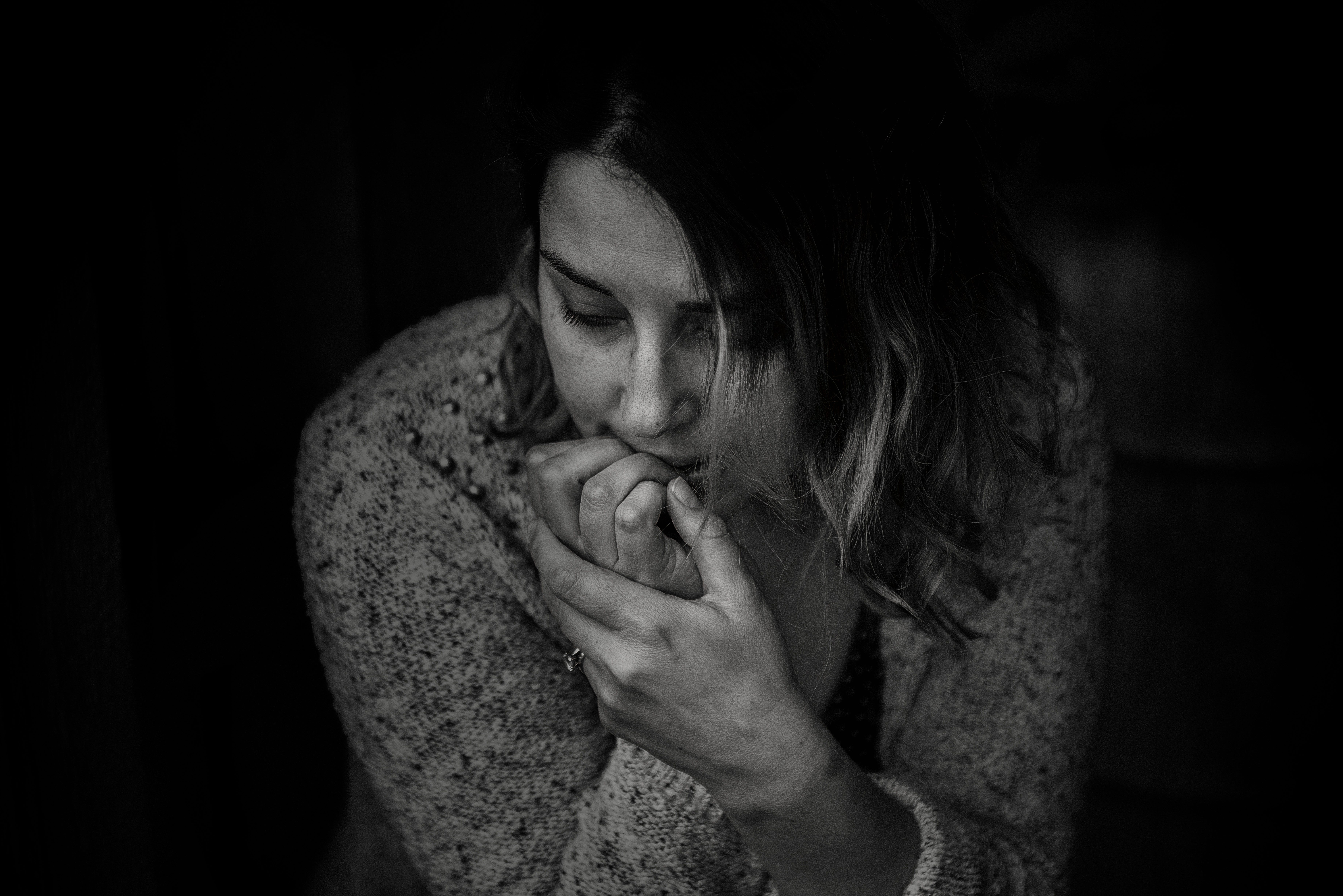 A woman with OCD biting nails