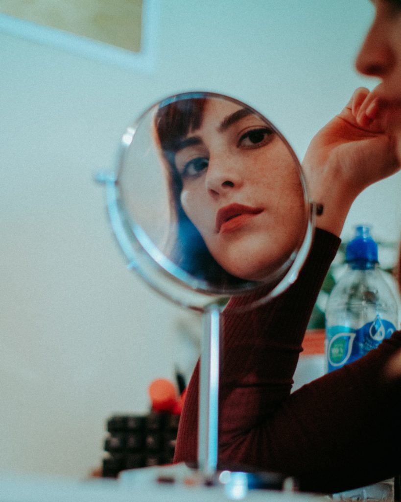 Girl looking in a mirror